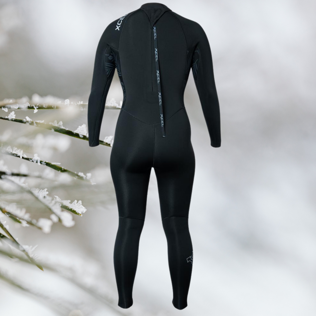 back view of Female XCEL Axis 5/4 back zip wetsuit in cold-water surf