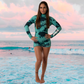 Women's surf wetsuit JANGA ALL STARS TIE DYE TEAL 2mm – front profile for warm water