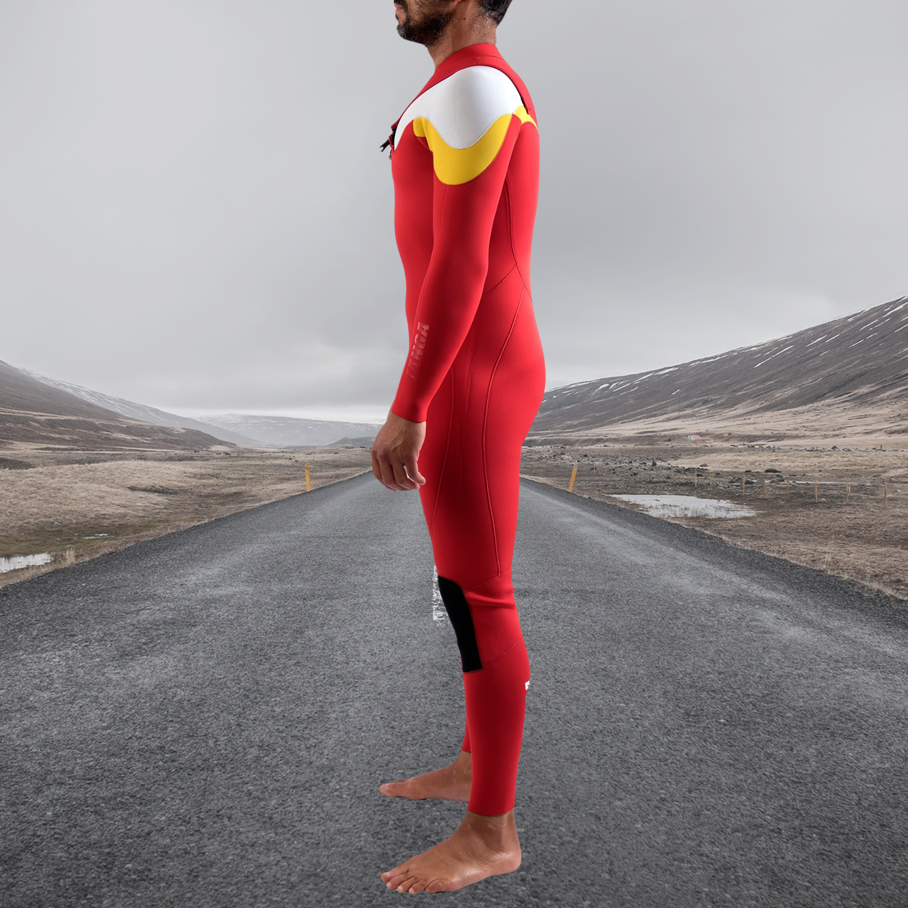 Surfer side view  JANGA ACID Chest Zip wetsuit for winter waves